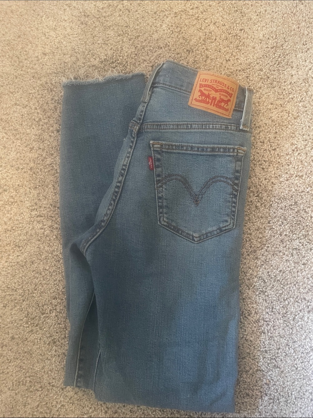 Levi's blue denim jeans with frayed hem